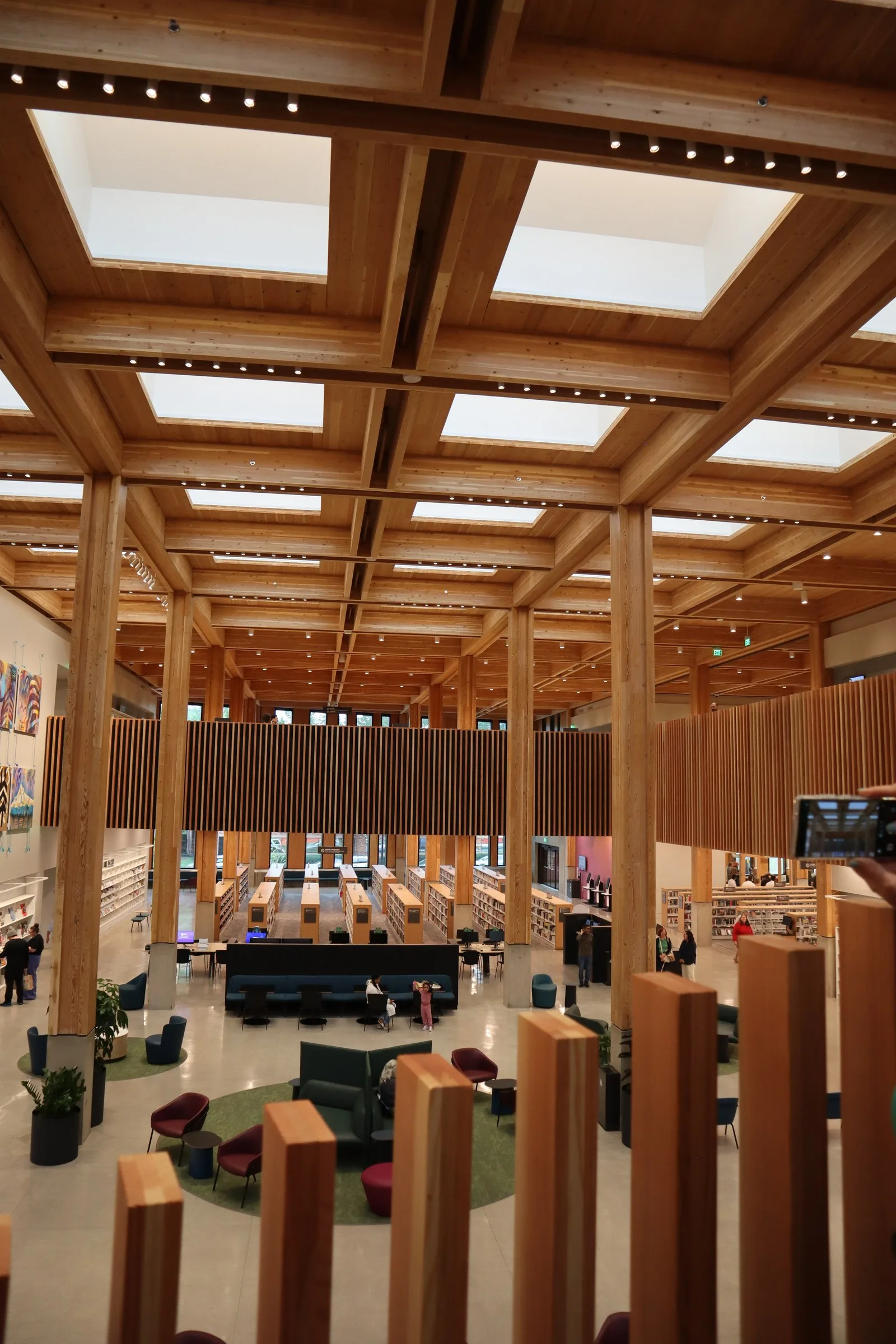 East County Library interior with a coffered timber ceiling and skylights