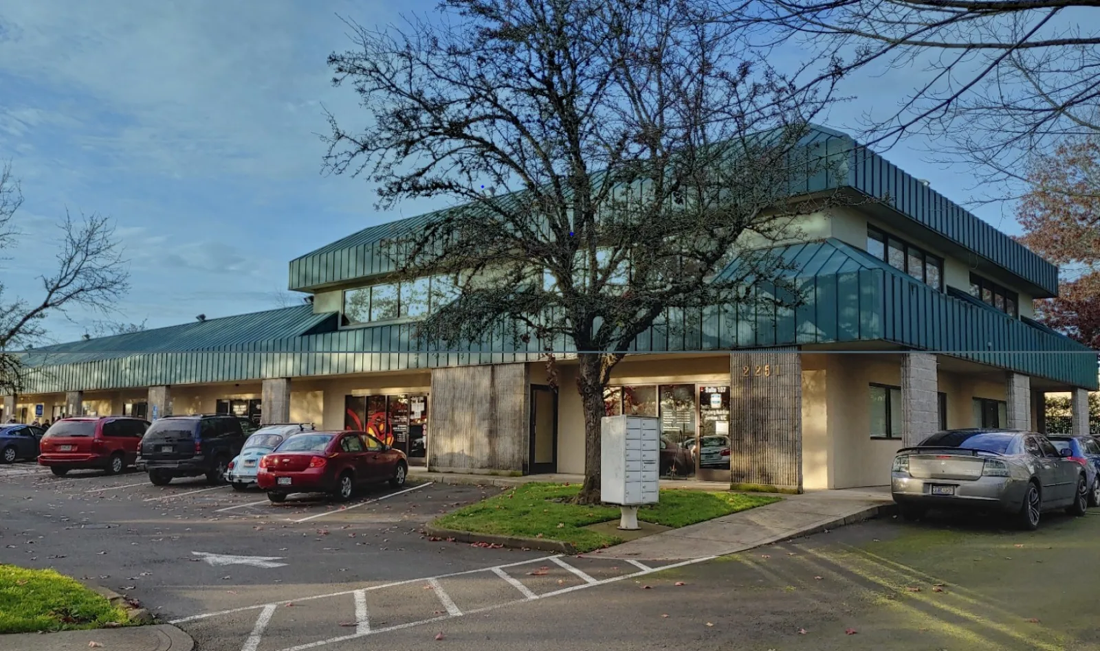 Virginia Garcia Health Center building with a green standing-seam roof